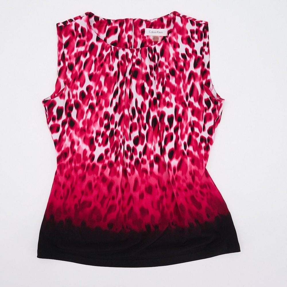 Calvin Klein sleeveless blouse has a bright pink, white, and black leopard print